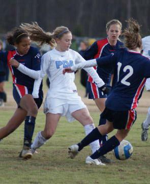 girls youth club soccer players from pda charge