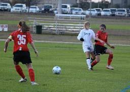 elite girls club soccer players compete n a club soccer tournament.