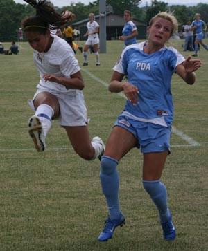 Elite girls club soccer players compete.