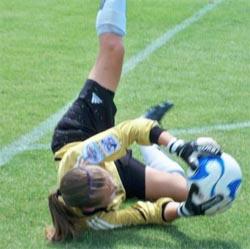 Girls club soccer player competes in a club soccer tournament.
